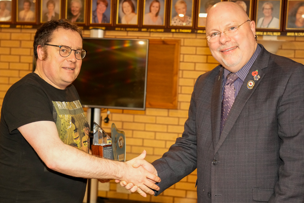 Tom Swallow receiving the  Novice Photographer of Year award from Rev Phil Denyer. 